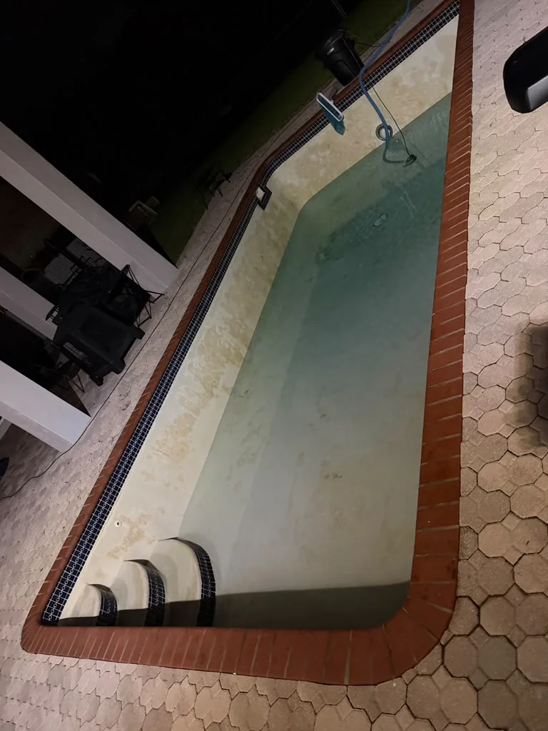 Stained pool surface before Pool Vice resurfacing